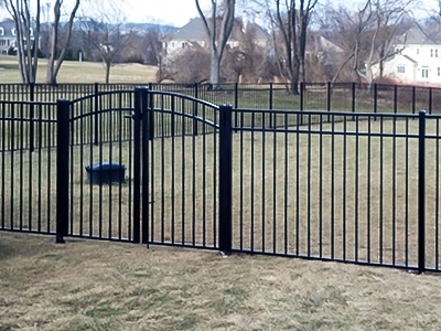 Black aluminum fence around backyard