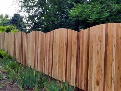 Vinyl privacy fence made of natural looking hardwood